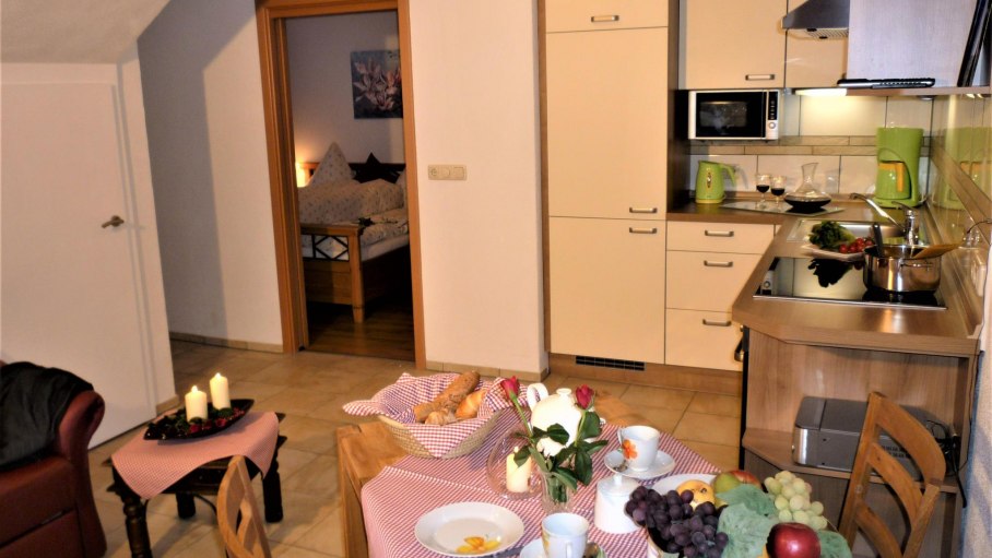 Wohnraum mit offener Küche im Erdgeschoss, © ambiente Ofterschwang - Familie Kneringer